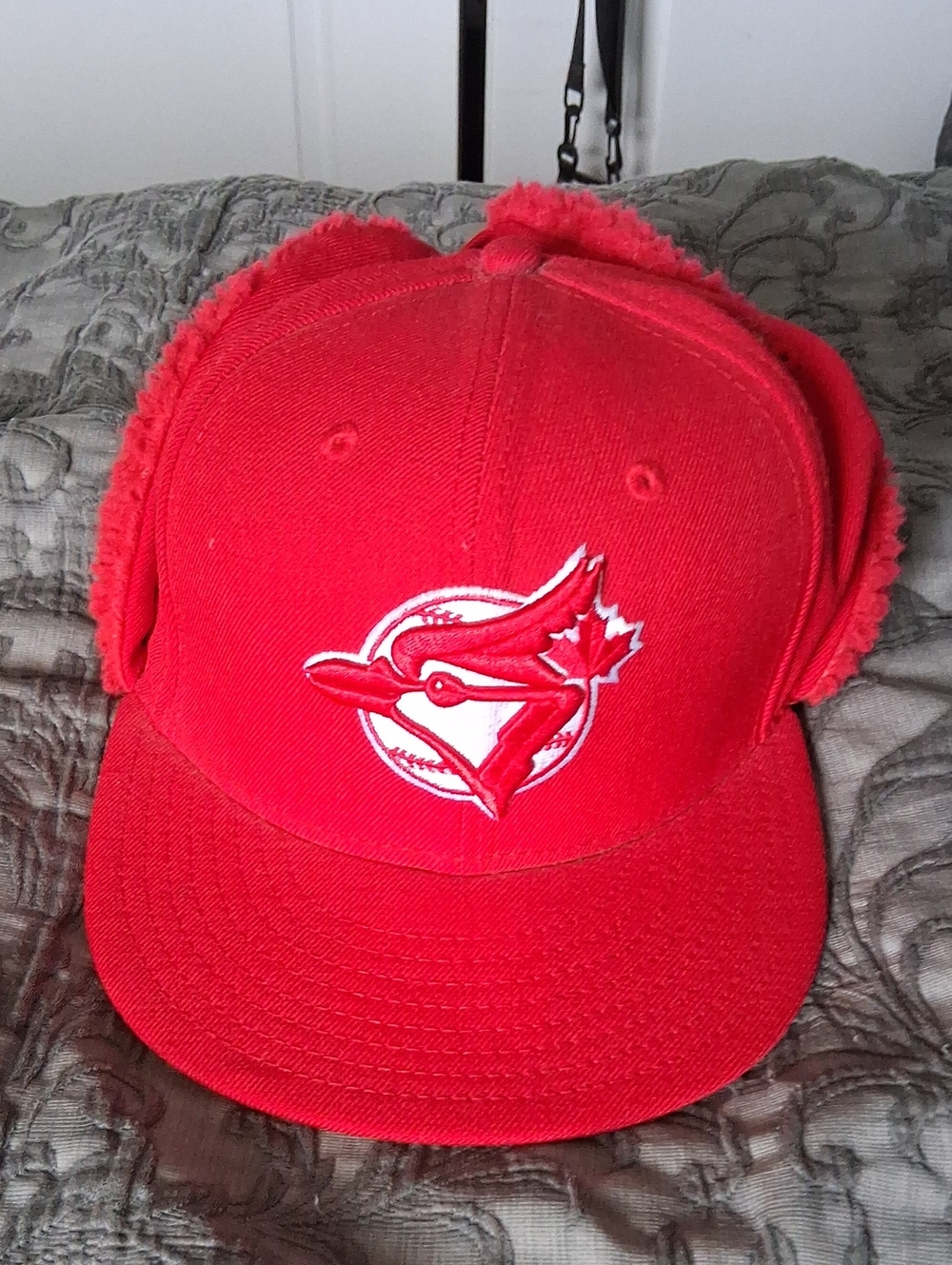 New Era Red Cap with Team Logo and Ear Flaps